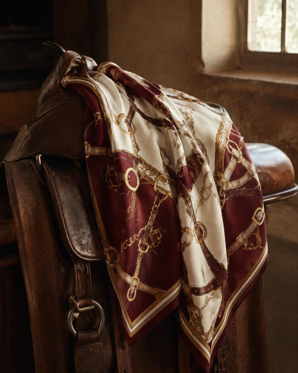 Vintage Hermès silk scarf with equestrian bridle motif in burgundy and gold